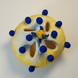Yellow and white wet-felted vessel with blue bobbles