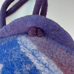 Cords pulled tight - closing the bag securely for wearing