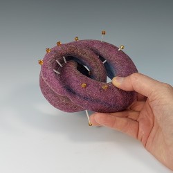 Curled felt form with bugle bead spines and round gold beads