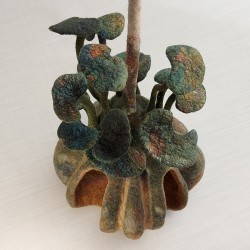 Wet‑felted gourd sculpture in merino wool, silk, and cotton. Decay, fungus, and new growth in fibre art
